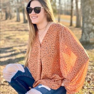 Print Chiffon top with a collarless neckline.